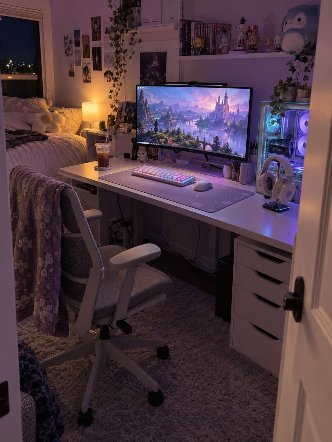 A cosy purple-lit gaming setup with an ultrawide monitor, white keyboard, headphones and figures on the shelf